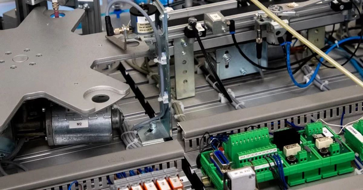 Factory floor electronics assembly representing component cost pressure