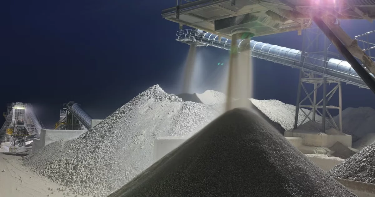 Open pit mine and processing infrastructure representing asset-heavy microcap companies