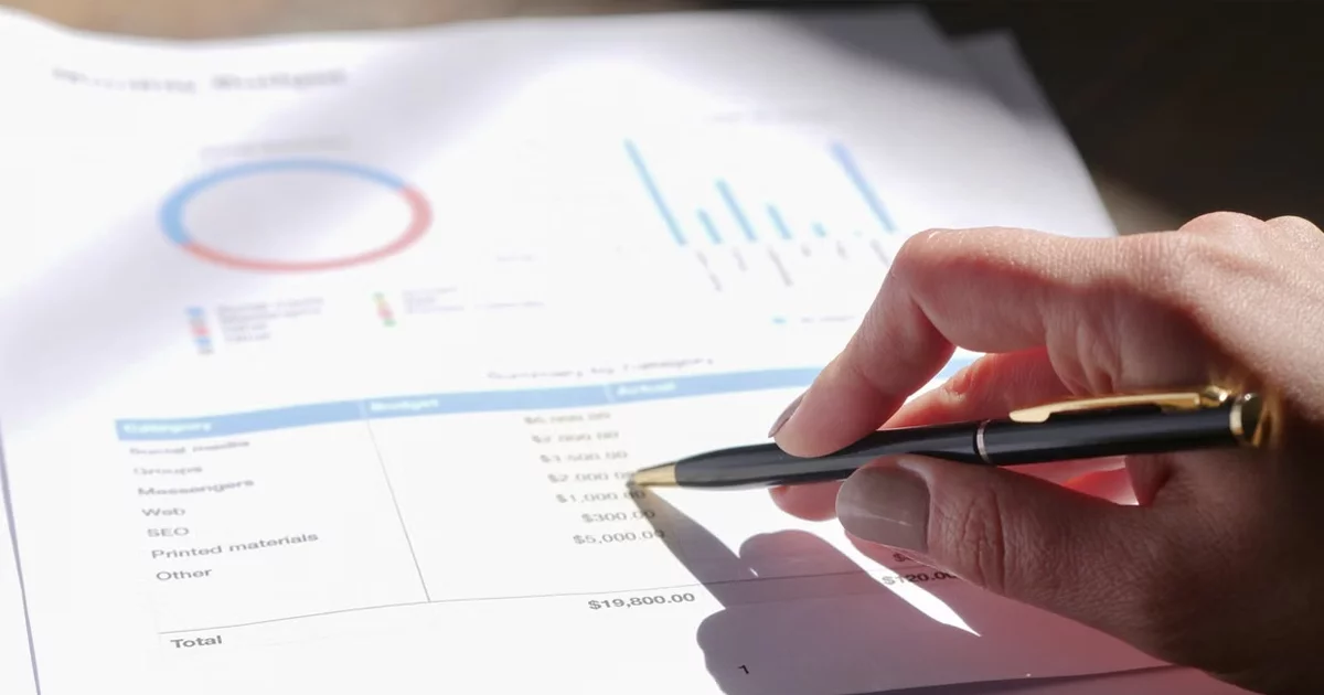 Contract pages and a calculator representing total contract value arithmetic